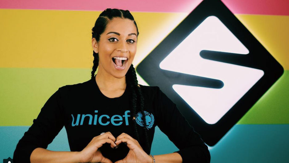 Youtube Star, Lilly Singh Lilly Singh poses with her hands in a heart symbol.